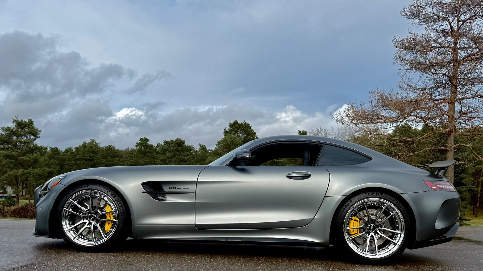 Side profile of the 2018 Mercedes-AMG GT R showing 19-inch front and 20-inch rear TW022 wheels