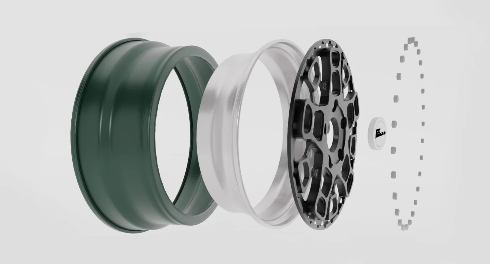 Exploded wheel design showing rim sections, a center disc, and fasteners