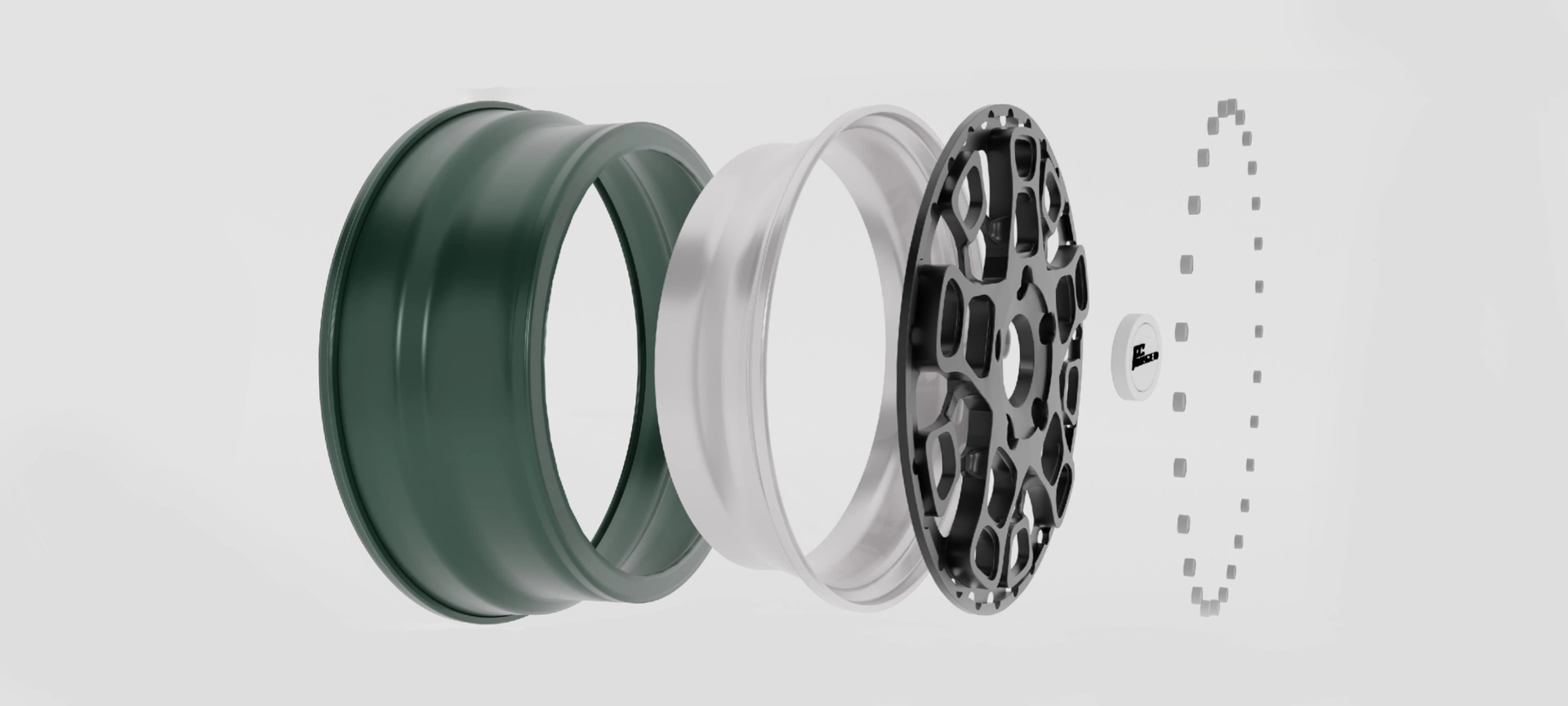 Exploded wheel design showing rim sections, a center disc, and fasteners