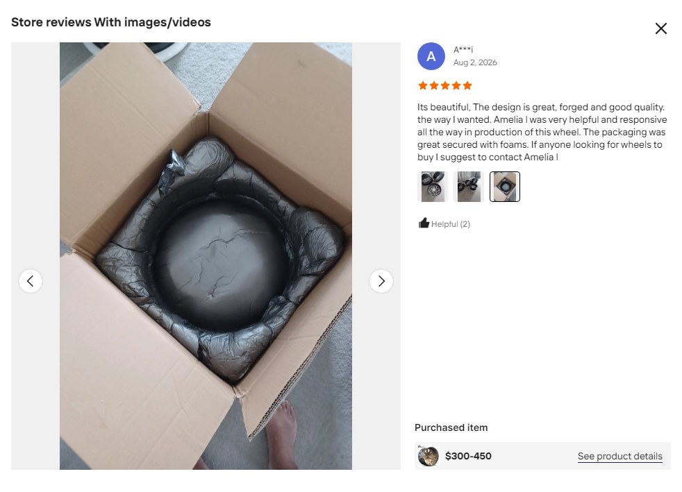Buyer review screenshot showing foam cushioning around a wheel inside its carton