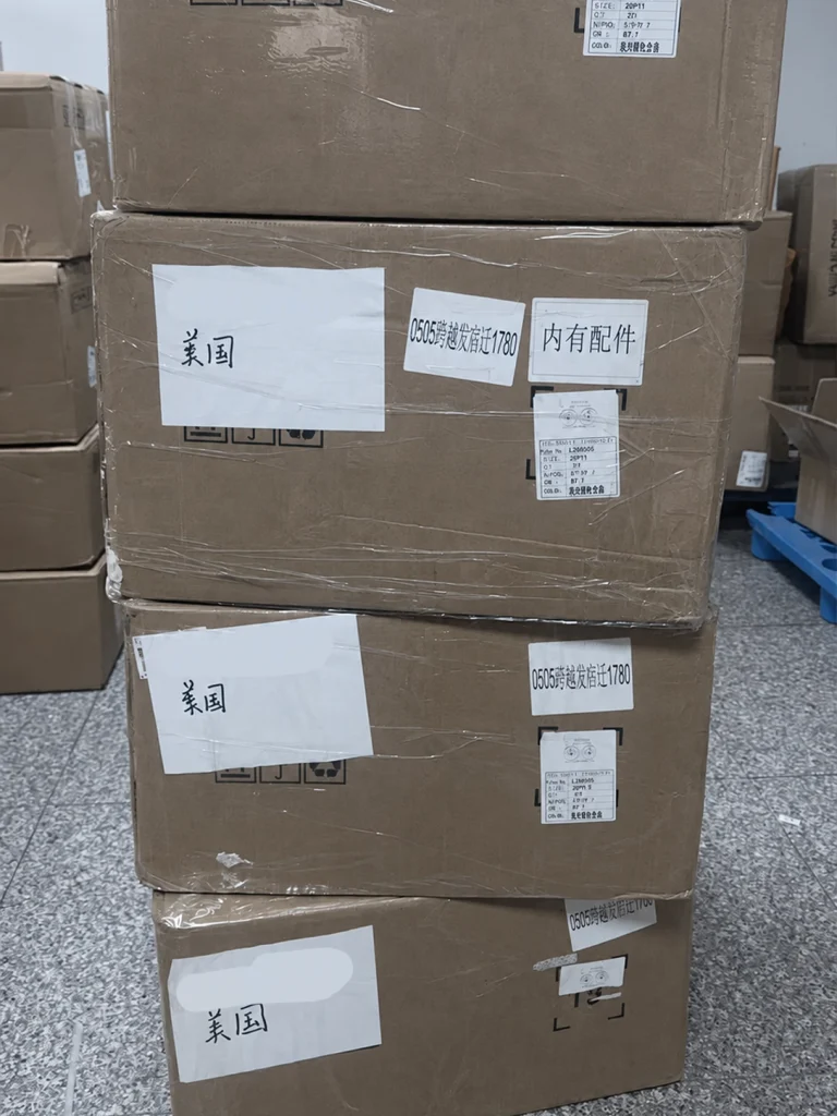 Stacked wheel cartons with destination and accessory labels