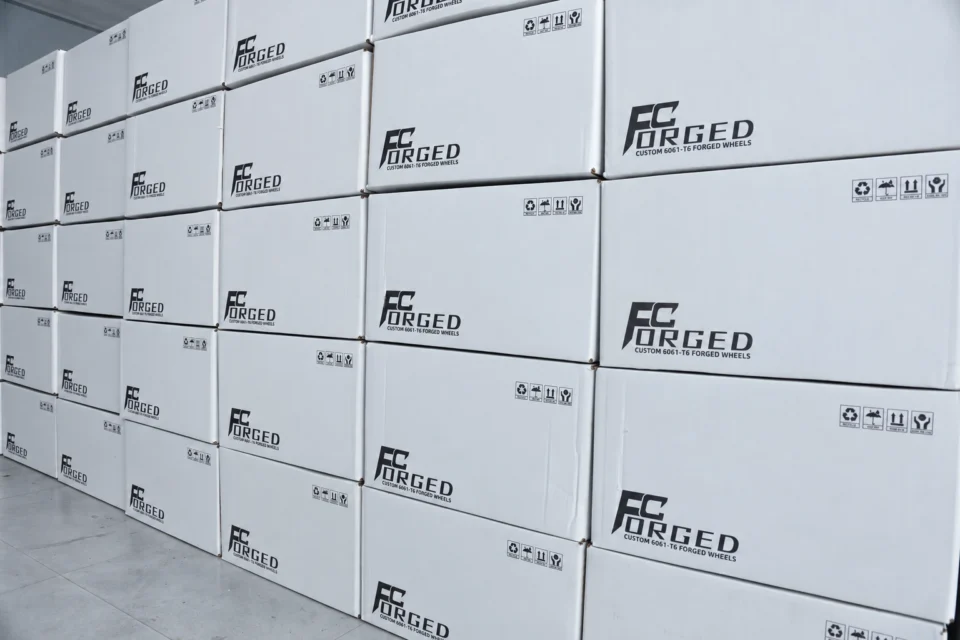 FcForged branded wheel cartons stacked ready for shipment