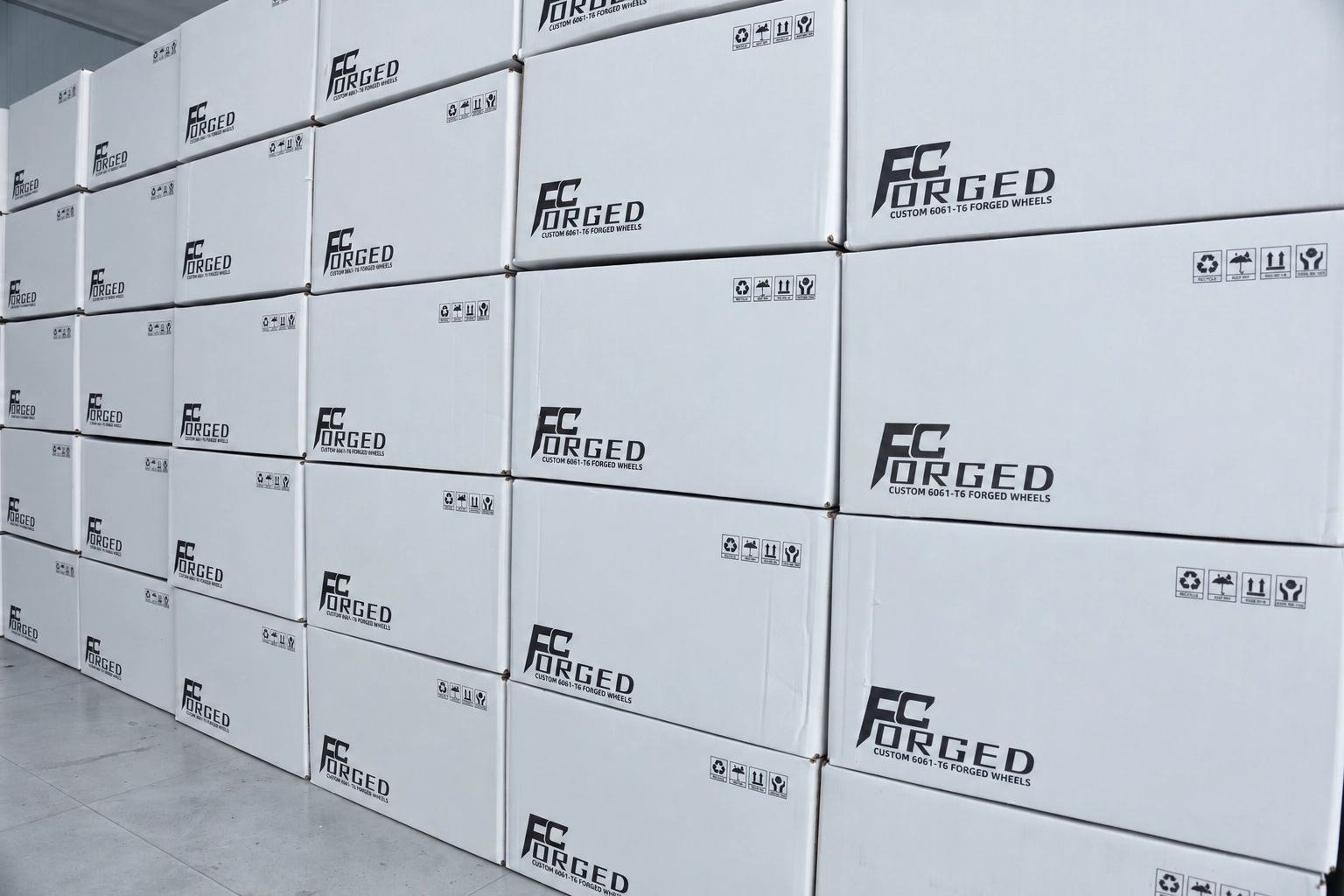 FcForged branded wheel cartons stacked ready for shipment